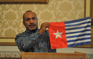 Benny shows his national flag to the  Freedom Forum, an act which in West Papua got him charged with a 25 year jail sentence