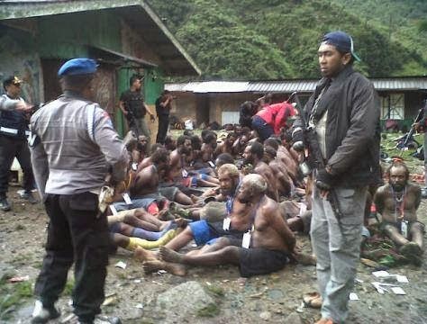 West Papuans being stripped, rounded up, and interrogated by Indonesian police in Timika