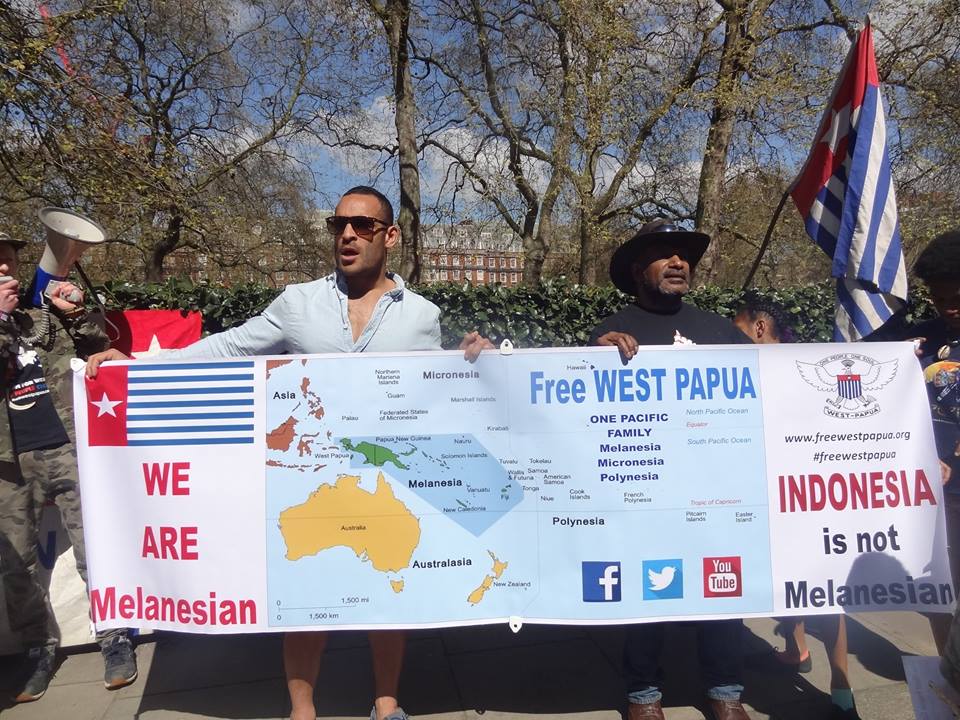 Benny Wenda holding a Pacific solidarity banner for West Papua with former PNG National Rugby League Captain, Paul Aiton